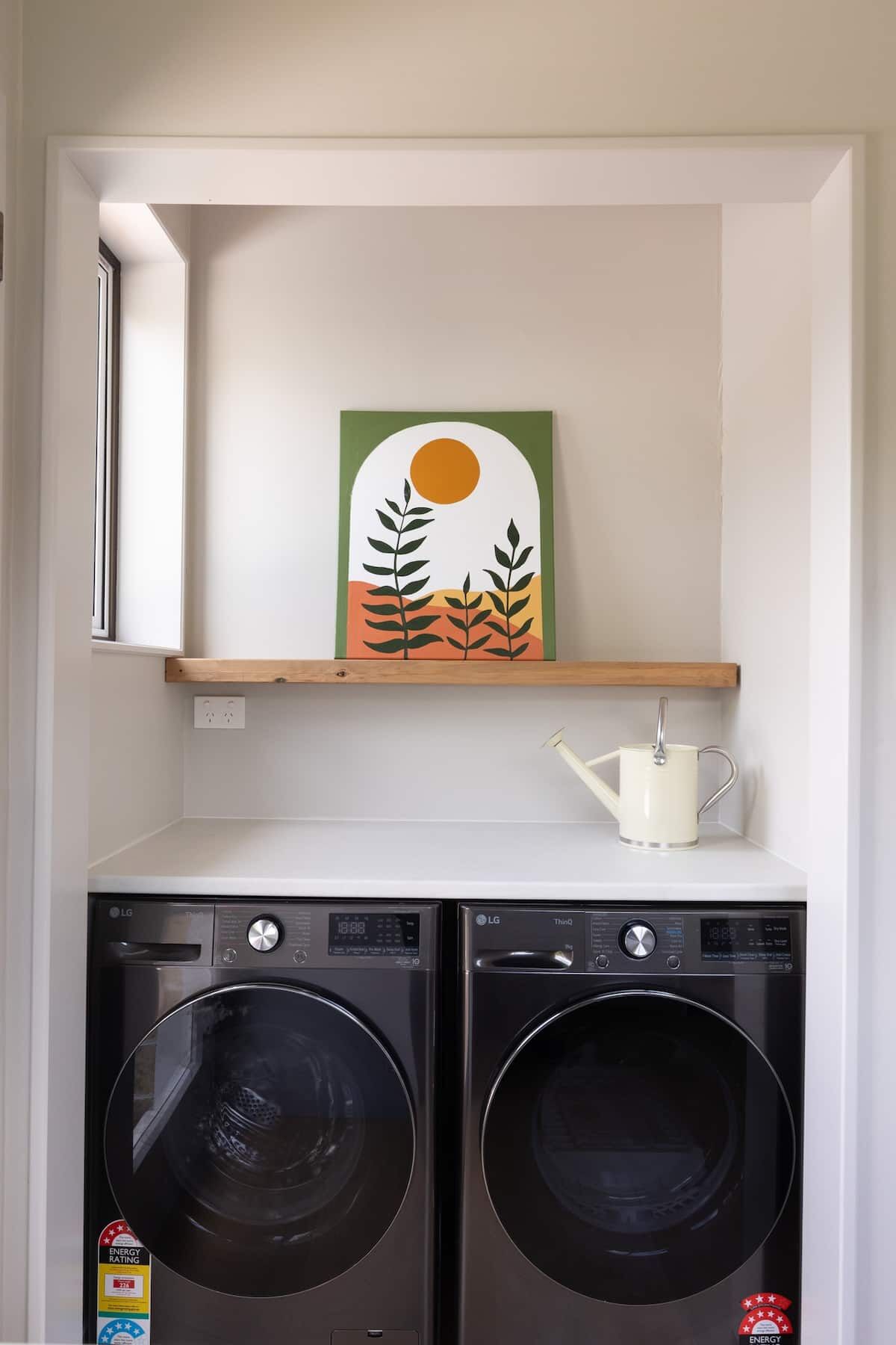 Washing machine and dryer side by side in the laundry at Nelson Bridge House